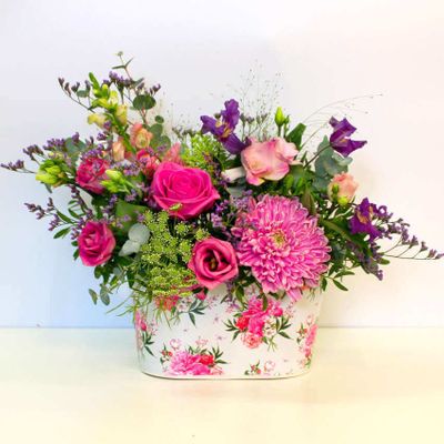 Our Floral Days Arrangement is a natural, garden inspired design of fresh flowers, expertly arranged in floral-foam for low maintenance by our local florists. The perfect choice if you're looking to send something a little different...
Please note: The container use may vary depending on local stock availability.